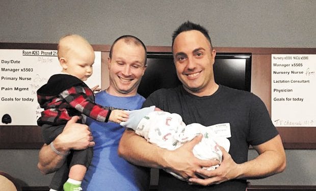 Hate crime survivor ends year as new dad