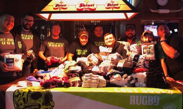 Rugby team collects socks for homeless teens