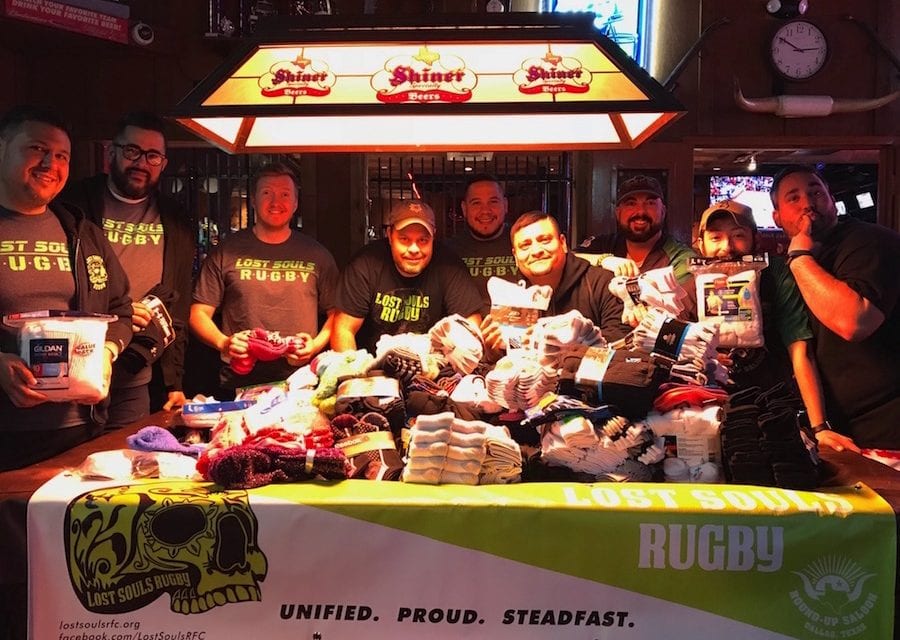 Rugby team collects socks for homeless teens