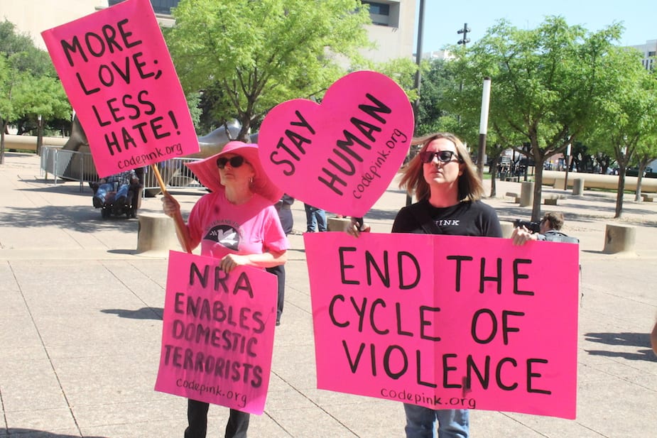 Protesters and counter-protesters mark the NRA's convention in Dallas ...